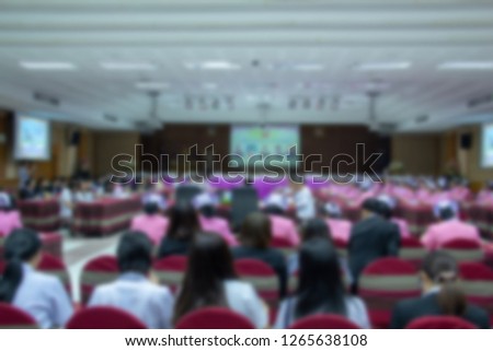 Health care worker meeting in meetingroom, blured background.