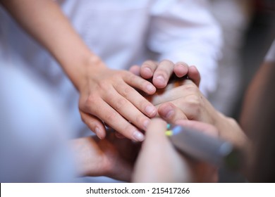 Health care workers demonstrating unity; teamwork concept