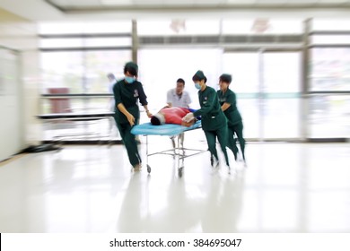 Health Care Workers Rushed Past Emergency Treatment Hall, Closeup Of Photo
