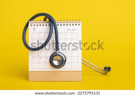 Health check up schedule concept, The idea of time for healthcare, Close up stethoscope and 2023 desk calendar on yellow background. Yearly planning for health check up concept. Stock fotó © 