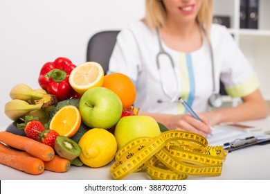 Health Coach Office With Vegetables And Tape Measure 