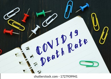 Health Concept Meaning Covid Death Rate With Inscription On The Piece Of Paper.