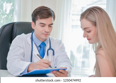 Health Concepts. The doctor is examining the patient's health. Patients are happy to come to the doctor. Medical examination results and Medical Consultation for Patients. The patient relaxes.