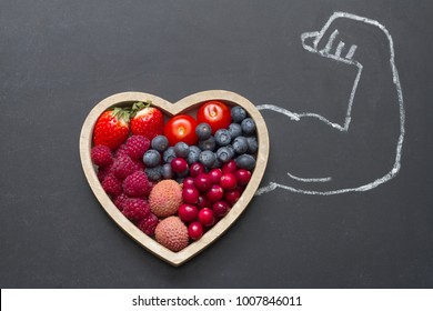 Health Diet Heart Abstract Concept With Strongman Hand On Blackboard 

