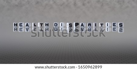 health disparities concept represented by black and white letter cubes on a grey horizon background stretching to infinity