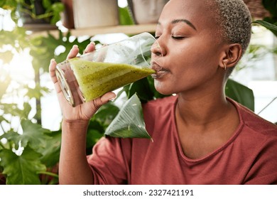 Health, drink and detox with black woman and smoothie for diet, breakfast and protein. Nutrition, food and weight loss with face of person and glass for green juice, vitamins and supplement - Powered by Shutterstock