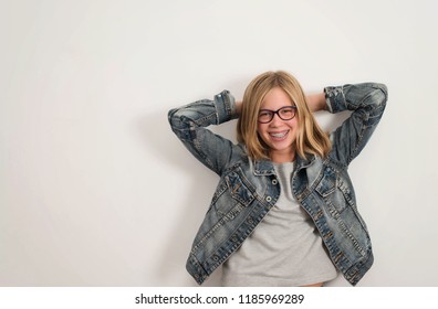 Health, education and people concept. Happy teen girl in braces and eyeglasses isolated.