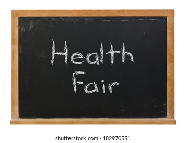 Health Fair Written In White Chalk On A Black Chalkboard Isolated On White