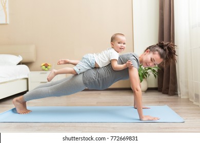 Health and fit concept. Young beautiful pregnant asian woman doing fitness exercise in the domestic room with her little kid son together. FItness materinity and motherhood