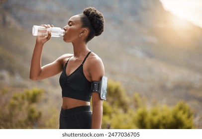 Health, fitness and black woman drinking water in nature for morning cardio, running or training at sunset. Exercise, wellness and African runner with sports, liquid or hydration for workout recovery - Powered by Shutterstock