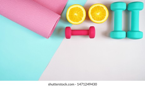 Health And Fitness Concept Flatlay With Exercise Equipment On Modern Colorful Background With Copy Space.