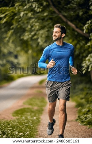 Health, fitness and man in park for running challenge, wellness and outdoor morning exercise. Training, cardio and runner on path in nature with commitment, progress and athlete in muscle workout.