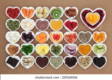 Health Food For Flu And Cold Remedy Cures High In Antioxidants And Vitamin C With Tablets, Medicinal Herbs And Spices In Heart Shaped Dishes. Immune Boosting. 