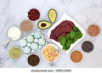 Health Food To Help Bi Polar Disorder An Manic Depression High In Omega 3, Protein, Selenium, Magnesium, Serotonin And  Tryptophan. Dairy, Meat, Seeds, Legumes, Vegetables, Grains. On Marble.