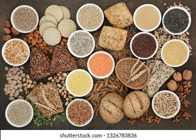 Health Food For A High Fibre Diet With Legumes, Whole Grain Bread Rolls, Whole Wheat Pasta, Seeds, Nuts, Grain And Cereals On Lokta Paper Background. High In Antioxidants, Vitamins And Minerals.