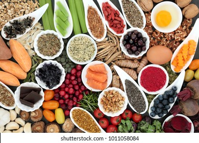 Health food to improve brain cognitive functions. Super foods concept very high in minerals, vitamins, antioxidants, omega 3 and anthocyanins. Top view.