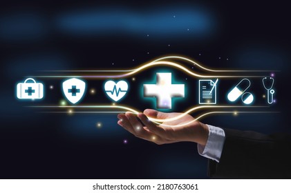 Health Icon Resting On The Palm Of A Businessman In Black Background. Concept, Medical, Healthcare.  Growing Growth In Hospital And Health Insurance Businesses  Insurance For Health Concepts.