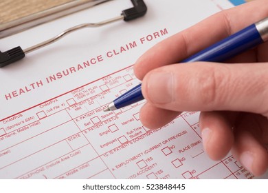 Health Insurance Claim Form With Pen 