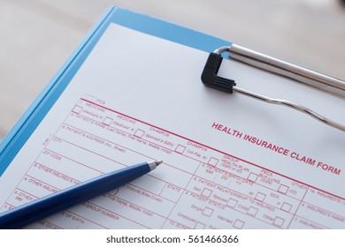 Health Insurance Claim Form With Pen 