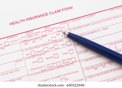 Health Insurance Claim Form With Pen And Glasses