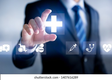 Health Insurance Concept, Businessman Holding Healthcare Medical Icon