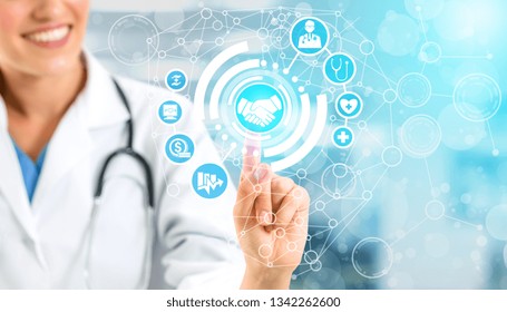 Health Insurance Concept - Doctor In Hospital With Health Insurance Related Icon Graphic Interface Showing Healthcare People, Money Planning, Risk Management, Medical Treatment And Coverage Benefit.