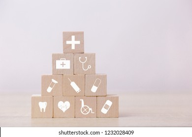 Health Insurance Concept,hand arranging wood block stacking with icon healthcare medical.