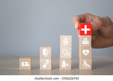 Health Insurance Concept,hand arranging wood block stacking with icon healthcare medical.