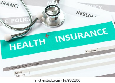 Health Insurance Form With Stethoscope In Top View