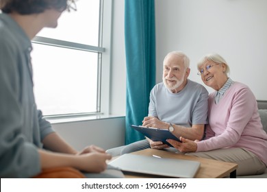 Health Insurance. Senior Couple Talking To Insurance Company Agent And Looking Involved