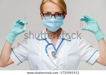 health medical worker woman holding vaccine and syringe