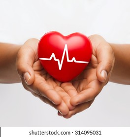 Health, Medicine And Charity Concept - Closeup Of African American Female Hands Holding Red Heart With Ecg Line