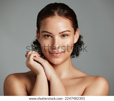 Health, natural and black woman skincare portrait for beauty cosmetic and glow treatment campaign. Healthy body care of model happy with beautiful freckles on face in gray studio background.