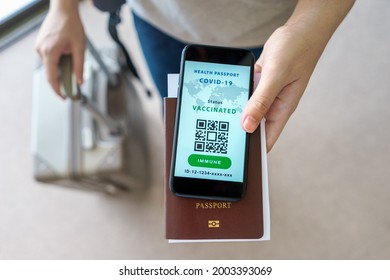 Health Passport Certification App, Tourist Uses Of Application On A Smartphone To Show Certify Vaccinated Status Of Coronavirus Covid-19 In Digital Heath Passport App At Airport With Citizen Passport