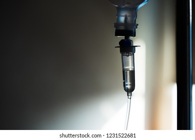 Health Patient Concept, Saline Solution In Tube Of Bottle In Patient Hospital Room. Saline Is Mixture Of Sodium Chloride In Water And Has A Number Of Uses In Medicine