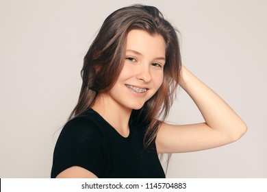 Health, People, Dentist And Lifestyle Concept - Portrait Of Teen Girl Showing Dental Braces. Candid Portrait Of A Girl Wearing Braces, With Hair Motion. Laughing Girl Wearing Braces, Cheerful Portrait