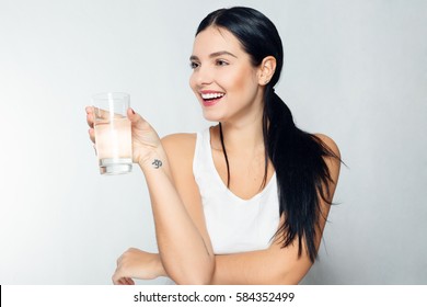 Health, People, Food, Sports, Lifestyle And Beauty Content - Smiling Young Woman With Glass Of Water