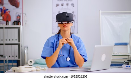 Health Physician Using Medical Inovation Wearing Virtual Reality Goggles In Hospital. Therapist Using Equipment Device Glasses, Future, Medicine, Physician, Healthcare, Professional, Vision, Simulator