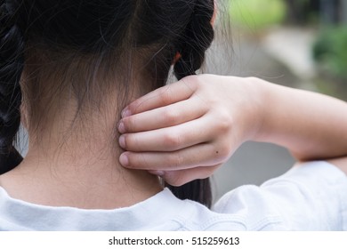 Health problem. Closeup asian girl  scratching her itchy back - Shutterstock ID 515259613
