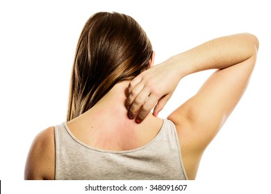 Health Problem. Young Woman Scratching Her Itchy Back With Allergy Rash Isolated On White