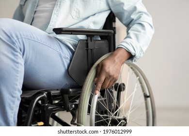 Health Problems, Sequelae Of Injury And Paralysis. Medical Care From Patient And Lifestyle. Millennial African American Male Disabled In Wheelchair With Hand On Wheel, Copy Space, Close Up, Cropped