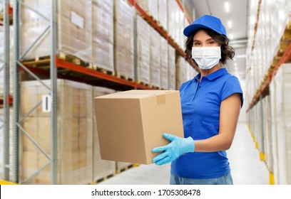 Health Protection, Safety And Pandemic Concept - Delivery Woman In Face Protective Medical Mask And Gloves Holding Parcel Box Over Warehouse Background