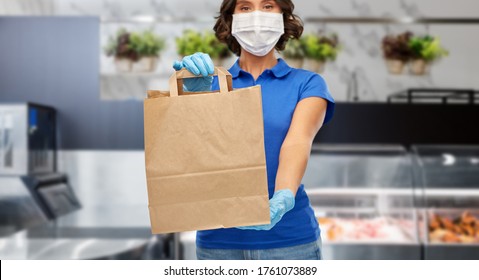 Health Protection, Safety And Pandemic Concept - Delivery Woman In Face Mask And Gloves With Food In Paper Bag Over Grocery Store Background