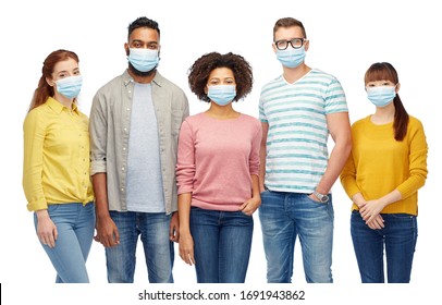 Health, Quarantine And Pandemic Concept - Group Of People Wearing Protective Medical Masks For Protection From Virus