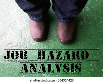 Health Safety And Environment (HSE) Copy Space Concept With A View Of Man Wearing Safety Shoe And A Safety Slogan Job Hazard Analysis Or JHA Or Job Safety Analysis.