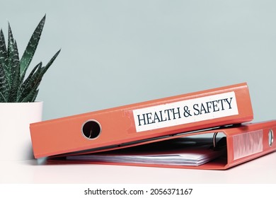 Health And Safety Labor Protection And Regulations At Work Place. Folder With Documents Or Instructions. Employees And Their Rights. Guidance Or Induction. Copy Space. Office Desk
