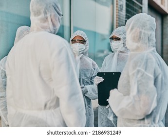 Health And Safety Personnel In Protective Gear Ready To Fight A Virus, Outbreak Or Pandemic. Hazmat Wearing Doctor, Nurse And Team Or Group Of Medical And Healthcare Professional At A Quarantine