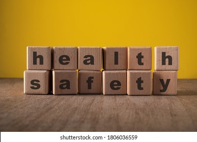 Health Safety, Wooden Block With Text. Health And Safety At Workplace Concept.