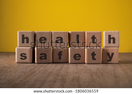 Health Safety, wooden block with text. Health and Safety at workplace concept.