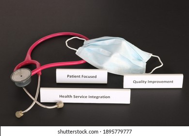 Health Service Integration And Patient Focused Quality Improvement Concepts For Responsible And Innovative Health Care Shown On Black Background